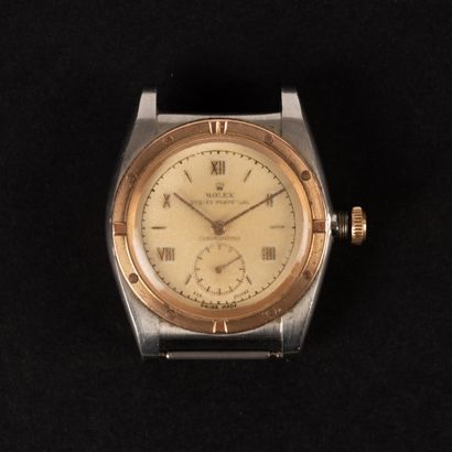 ROLEX circa 1950. Steel and 9k gold watch...