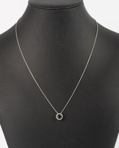 White gold pendant set with a modern round...