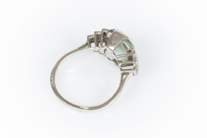 Gold and platinum ring set with an emerald-cut...