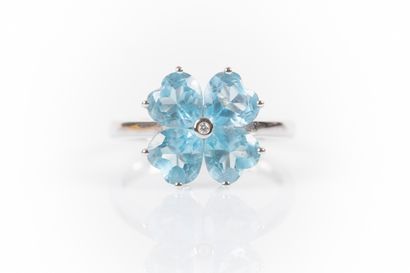 White gold flower ring set with a diamond...