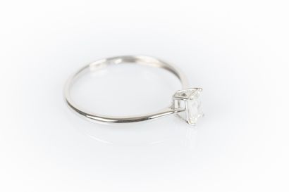 White gold solitaire set with a baguette...