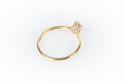 Yellow gold solitaire set with a pear-shaped...