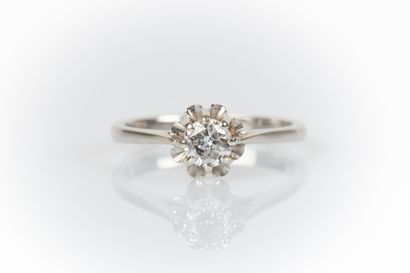 White gold solitaire set with a round modern-cut...