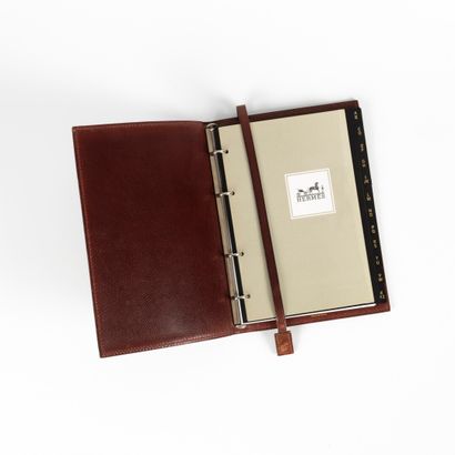 HERMES. Bordeaux grained leather agenda holder...
