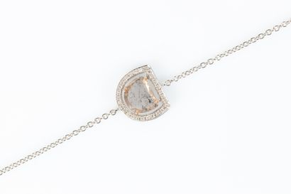 Two-tone gold bracelet centered on a faceted...