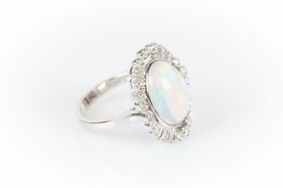 White gold ring set with an oval cabochon...