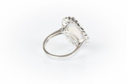 White gold ring set with an oval cabochon...