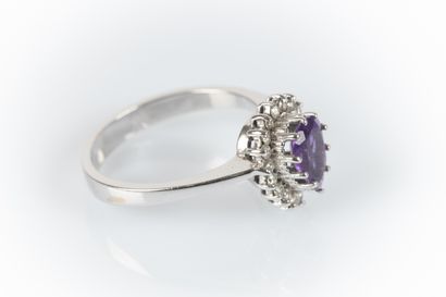 White gold ring set with a pear-shaped amethyst...