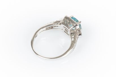 White gold ring set with a round blue zirconia...
