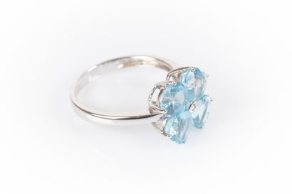 White gold flower ring set with a diamond...