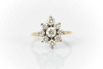 Bague marguerite en or et argent sertie de...