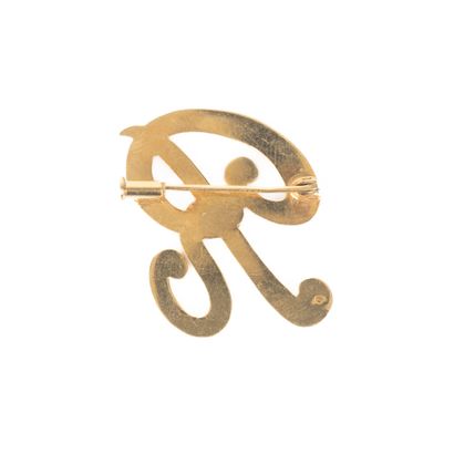 Broche en or en forme de R. 6,34 g. 3 cm...