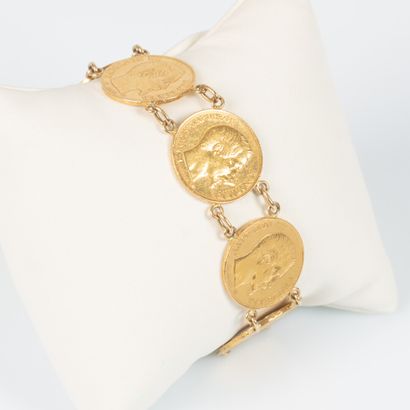 Bracelet en or serti de 7 monnaies en or...