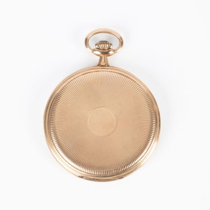 Montre de poche plate en or guilloché à décor...