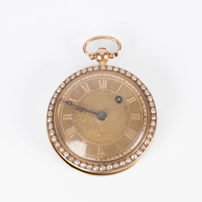 Montre de poche en or sertie de demi-perles...
