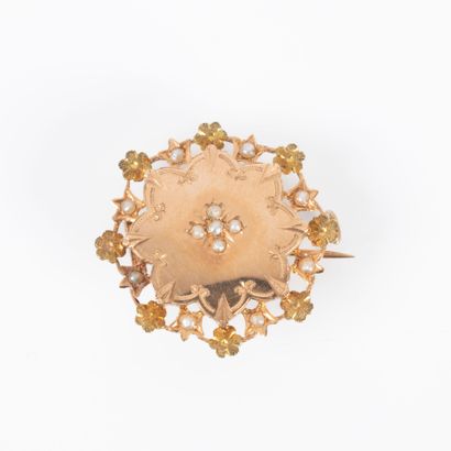 Broche rosace en or rose et jaune serti de...