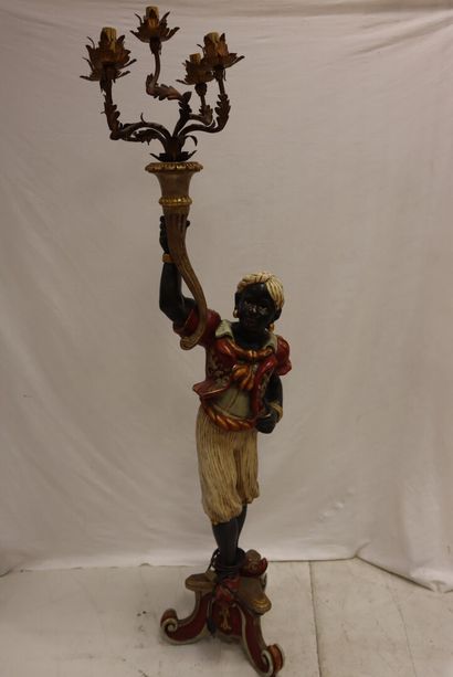A Nubian torchbearer in wood and polychrome...