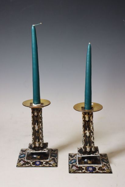 Pair of enamel candlesticks decorated in...