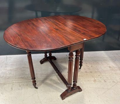 Oval mahogany folding shutter table with...