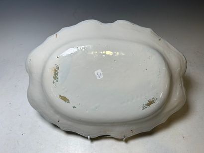 MOUSTIERS. 
Earthenware dish with turned-up...