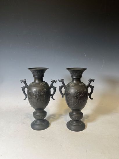 ASIA. 
Pair of bronze vases with floral decoration,...