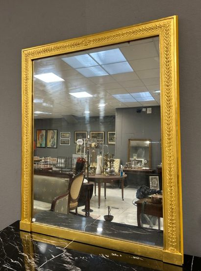 Rectangular wood and gilded stucco mirror...