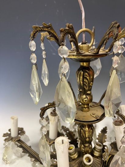 Gilded metal chandelier with eight arms of...