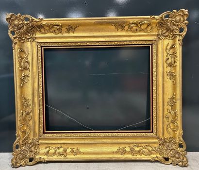 Large carved and gilded wood frame with mantling...