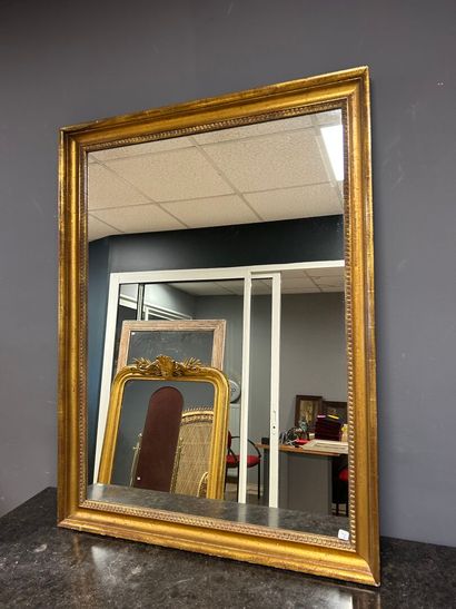 Gilded wood mirror with water lily frieze...