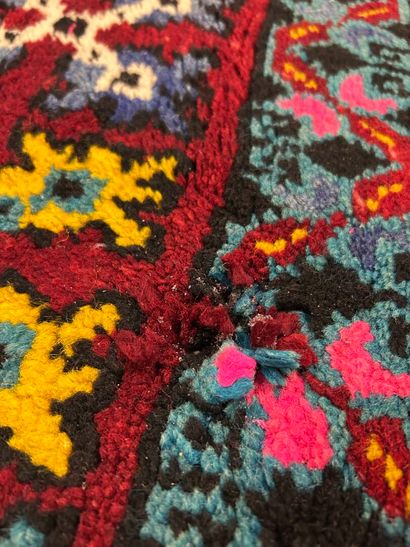 Caucasus rug with geometric design on a red...