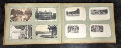An album containing 400 vintage postcards,...