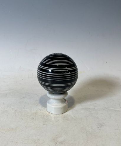 Ceramic staircase ball with black stripes...
