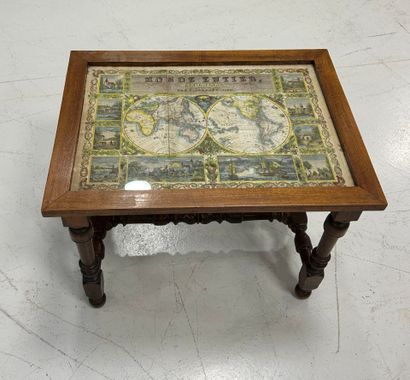 Turned wood coffee table with world map decoration.
Height...