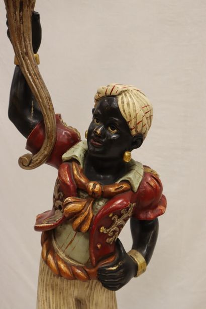 A Nubian torchbearer in wood and polychrome...