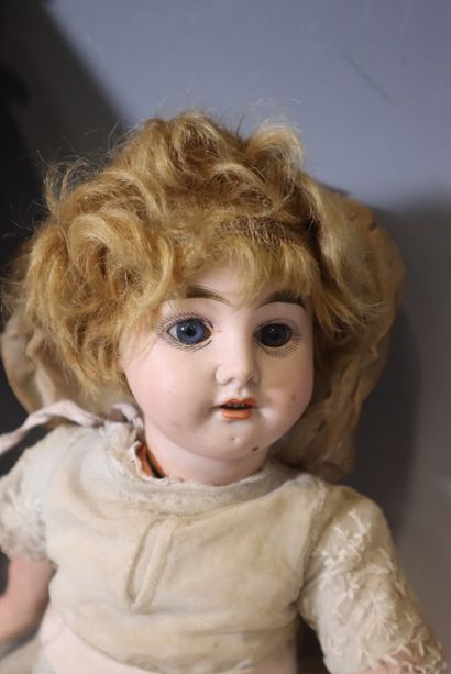Set of two wooden dolls with porcelain heads...