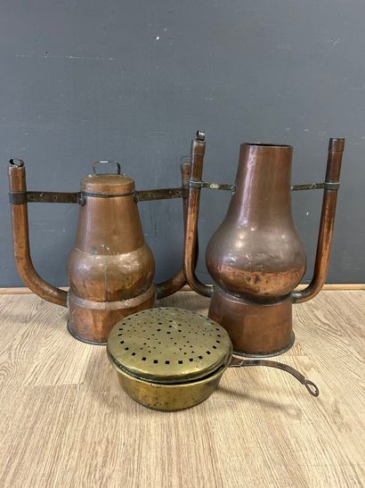 Two copper bath warmers, one with its lid,...