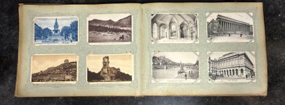 An album containing 400 vintage postcards,...