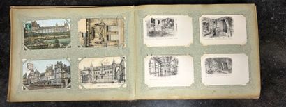 An album containing 400 vintage postcards,...