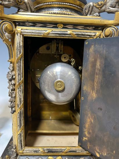 Gilded and brown metal mantel set in the...