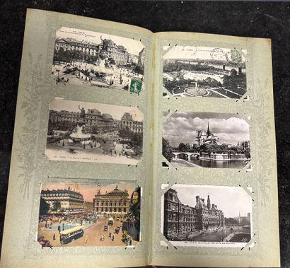 An album containing 500 old postcards on...