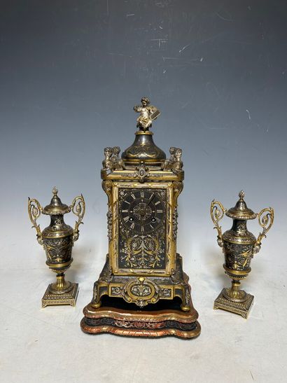 Gilded and brown metal mantel set in the...