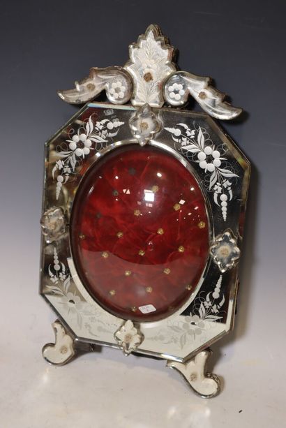 Glass reliquary frame with floral decoration....
