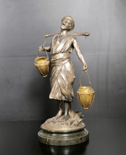 . Le porteur d'eau arabe. Groupe en régule...