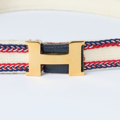 HERMES. Lady's belt in blue-white-red canvas,...