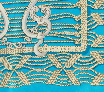 HERMES. Stole in turquoise and beige silk,...