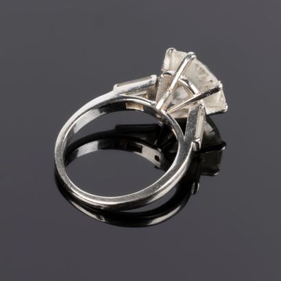. Gold and platinum solitaire set with a...