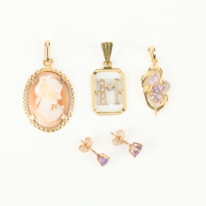 Gold jewelry set with small stones and shell...