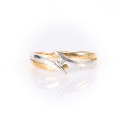 Two-tone gold cross ring set with a brilliant-cut...