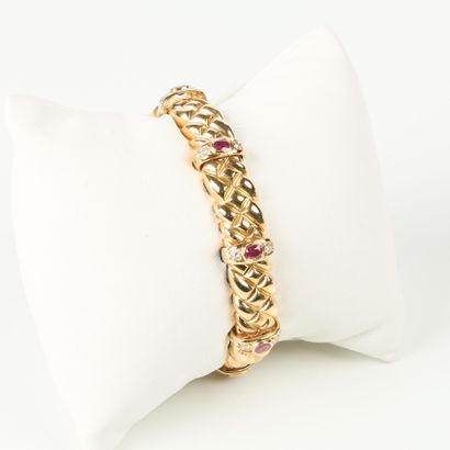 Rigid articulated gold bracelet with quilted...