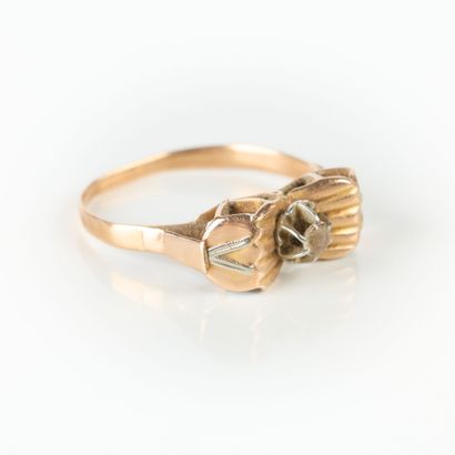 Two-tone gold ring set with a white stone....